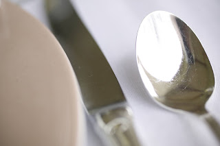 knife; spoon; place setting; table setting