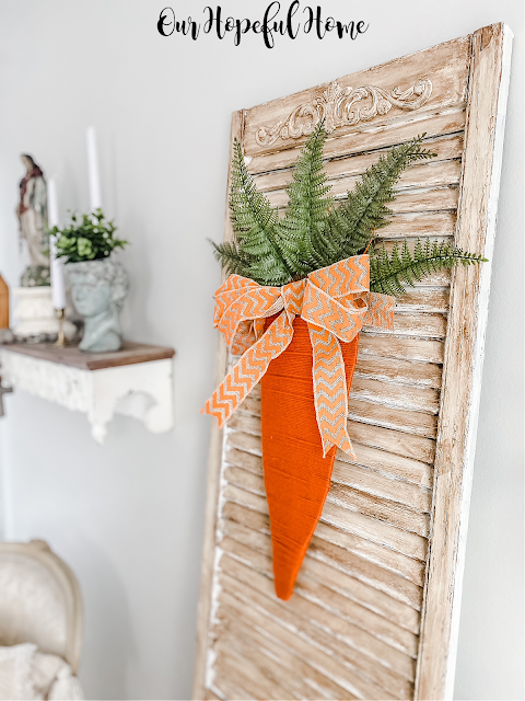 orange carrot wire swag hanging on shutter