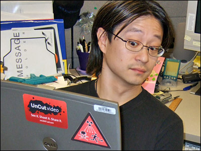 Journals Editor Joe With a Radiation Warning Sticker on His Laptop