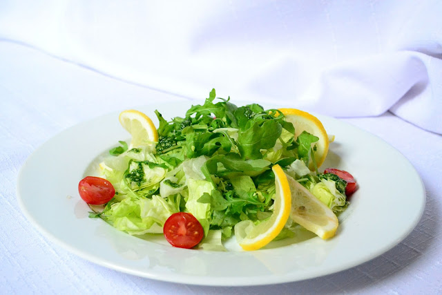 Salad with iceberg and dark green lettuce mixed together