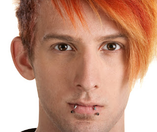 Teen boy with orange hair and lip piercings