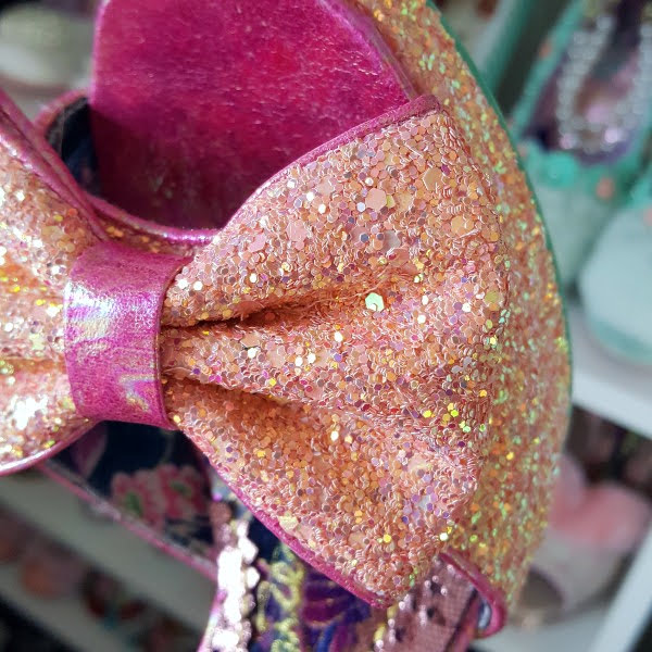 close up of pink glitter bow on shoe