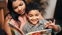 Parent and child reading a book
