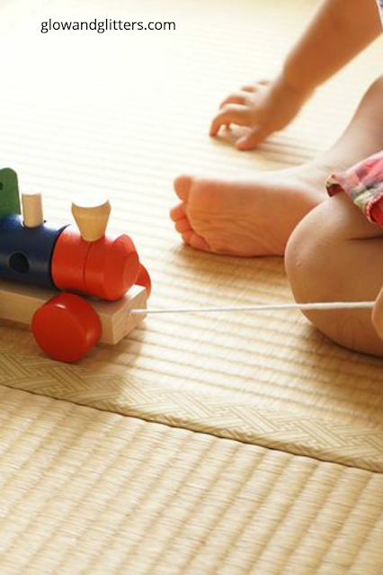 Nursery rugs and playing.