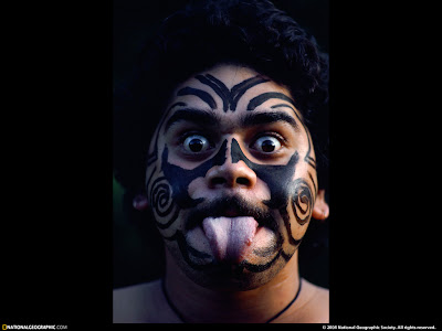 Maori tattooing. The puhoro on thighs, kauwae on chin, &c
