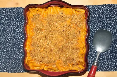 Top view of finished dish of Butternut squash macaroni and cheese with hazelnut crumble.