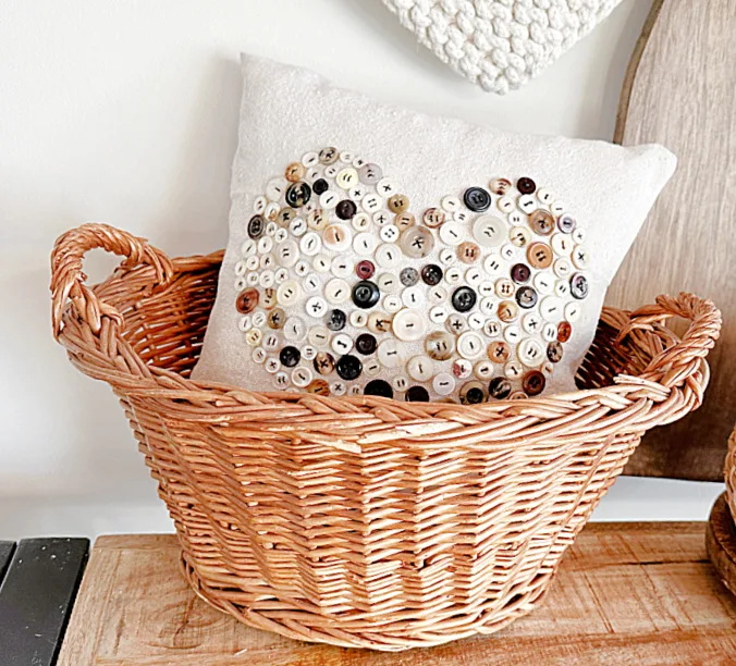 heart button pillow in basket