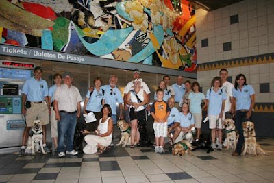 Puppies with a Vision puppy club in the os Angeles Metro Rail Subway station