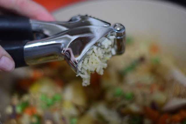 The mince garlic being added to the pot.