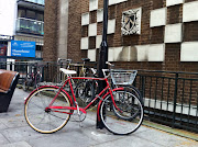 Black Dog Day Going for a ride on a red bike (red bike with black dog)