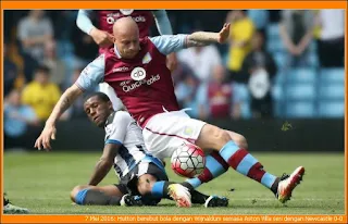 Hutton berebut bola dengan Wijnaldum semasa Aston Villa seri 0-0 dengan Newcastle sekaligus mengheret Newcastle ke kelompok penyingkiran.