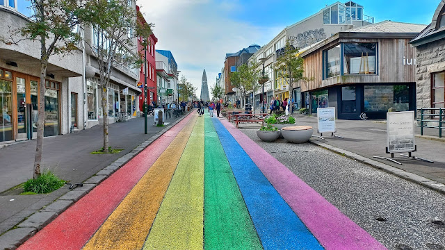 Rainbow street and Hallgrímskirkja in the back at Reykjavik, Iceland
