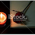 Still life rose flower on books and candle background - Stock Image