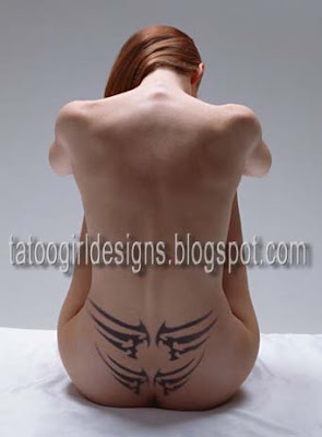 double wings lowerback-tattoo girl