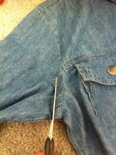 Cutting the sleeves off my denim shirt to create a denim vest!