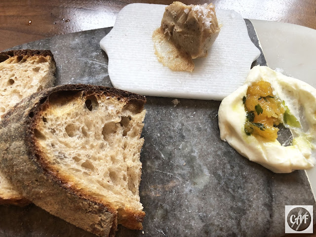Homemade whole wheat sourdough bread and housemade date butter at Oak and Rowan restaurant, Fort Point, Boston, MA