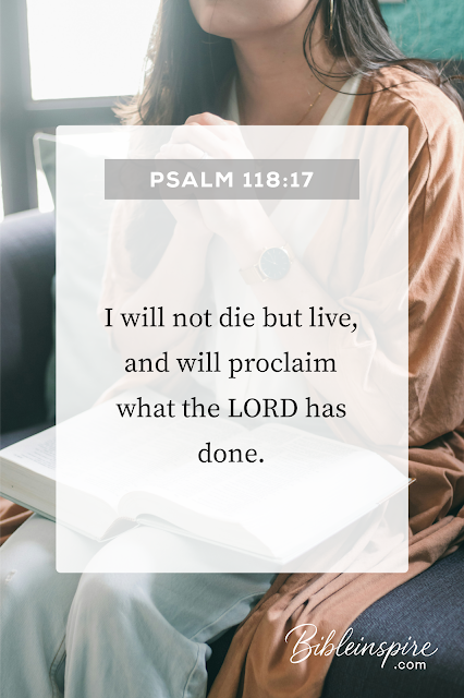 Woman praying with an open Bible featuring Psalm 118:17, an affirming bible verse to pray against bad dreams, declaring life and God's works.