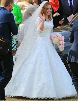 Geri waves to the crowd after church wedding service.