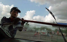 Windshield Wiper man cleaning car window