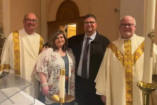 How Protestant minister embraced the truth of the Catholic Church,  Recent convert Steve Dow and his wife Amanda pose for a photo with Deacon M.J. K