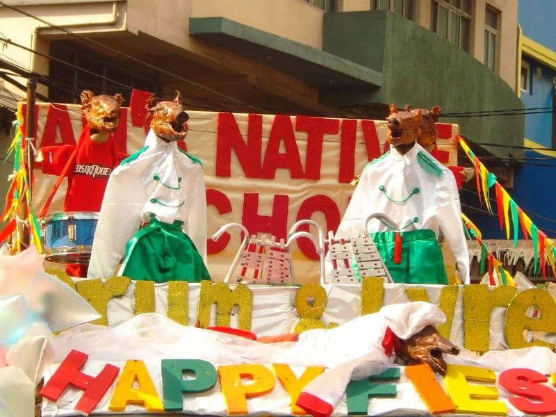 Lechons in drum and lyre costumes at the La Loma Lechon Festival