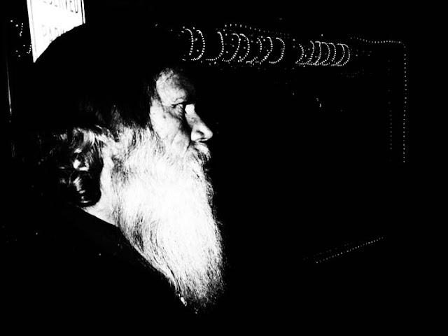 A bar patron with a big white beard at Cactus Jack's Saloon in Evergreen, Colorado.