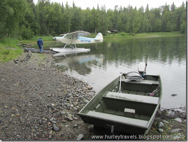 Private plane and fishing boat on Christiansen Lake near Talkeetna, AK.
