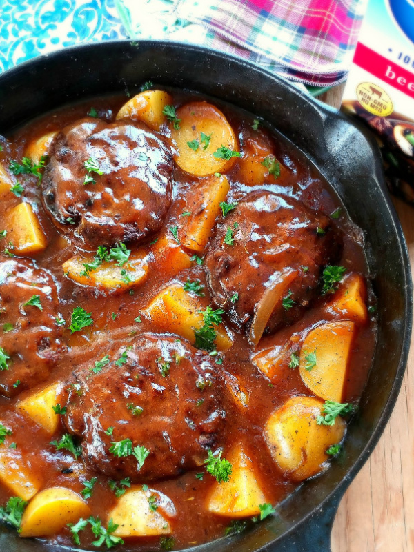Salisbury Steak & Potato Skillet Dinner! A one-pan recipe with tender hamburger steaks, potatoes and scratch-made gravy that cooks in just 30 minutes.