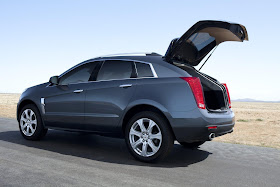 Rear 3/4 view of 2011 Cadillac SRX with hatch open