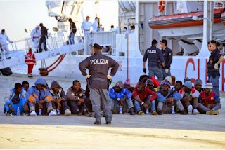 Italian police said Thursday they had arrested a group of African migrants after witnesses said they threw 12 passengers overboard following a row about religion on a boat headed to Europe.