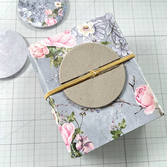 Mini album created with: Sizzix card case bigz die, express glue, hot glue gun, framelits circles die; Prima Marketing the plant department collection; Pinkfresh clear drops iridescent gems; Tim Holtz foundry wax, adornaments foliage, tiny attacher