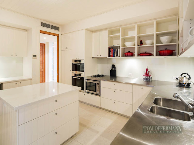 Photo of modern kitchen furniture in waterfront villa