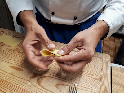 Folding the pasta into tortelloni shape