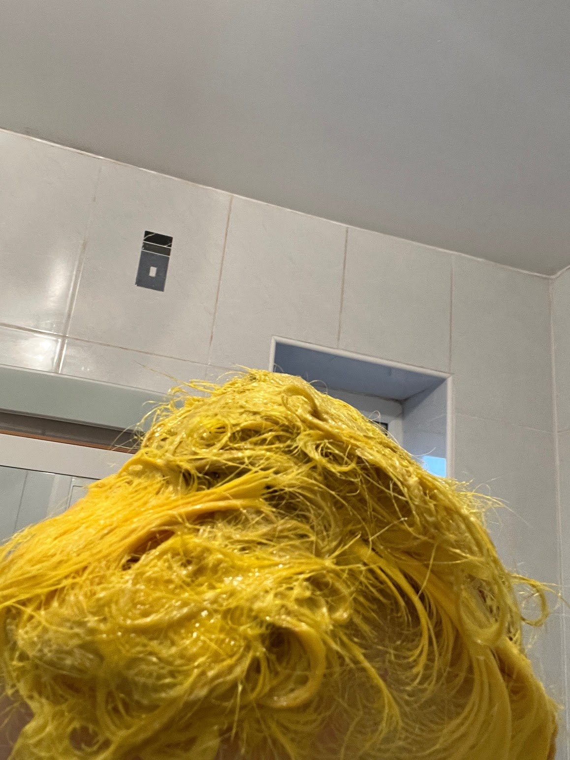 Bleach London Twisted Lemon dye during developing. Lemon yellow is saturated in yellow dye and piled on my head.