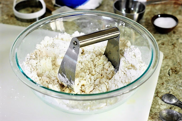 Cutting Butter into Flour to Make Fluffy Buttermilk Biscuits Image