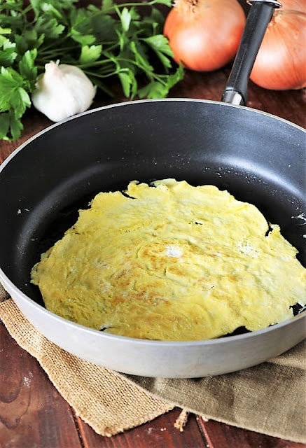 Cooking Egg to Make Skillet Shrimp Fried Rice Image