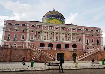 Magnificent pink tiled building with dome in the colours of the Brazilian flag