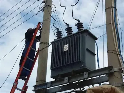 Kenya Power employees connecting a transformer. PHOTO | RMS