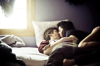 sweet couple lying on bed