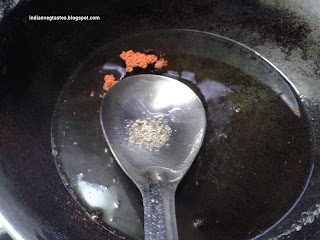 Add food colour and cardamom powder to the syrup