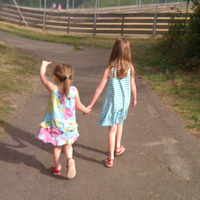 stephs two girls walking away hand in hand
