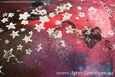 a galaxy background made using Distress Spray Stains and Embossing Powders by Jenny James