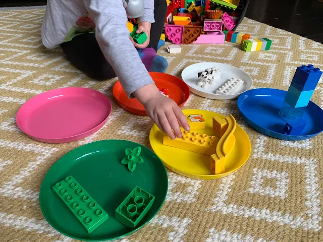 Sorting LEGO DUPLO into matching coloured IKEA plates