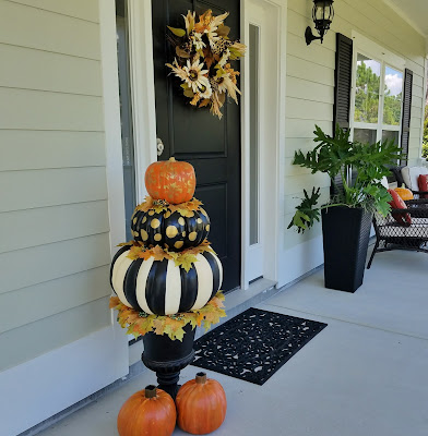 painted pumpkin topiary and solar pumpkins