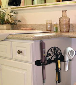 wall-mounted hair care caddy with dryer and curling iron