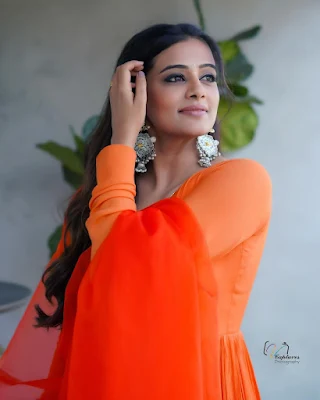 Priyamani smiling and laughing while wearing a casual outfit