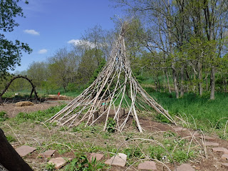 a stick tipi provides a bit of shelter in the Children's Garden at Lauritzen Gardens