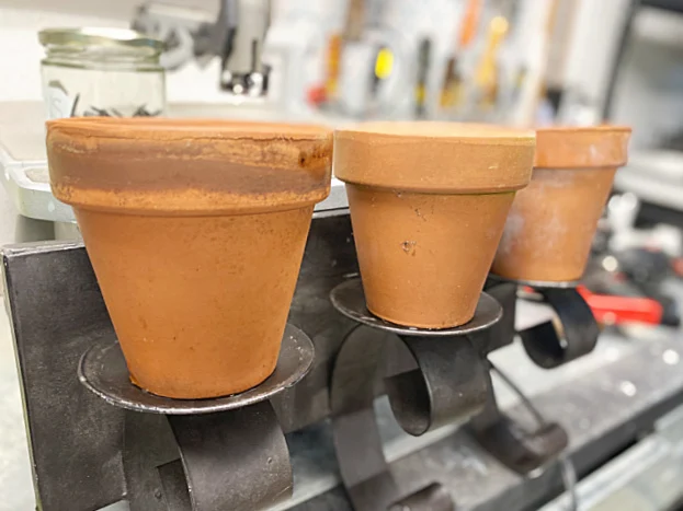 terra cotta pots on candle holder