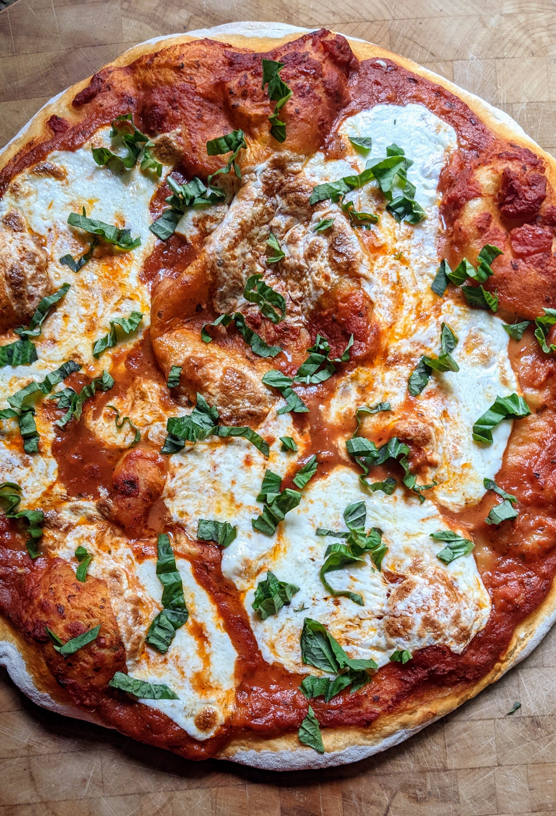 Margherita Pizza on Wooden Cutting Board