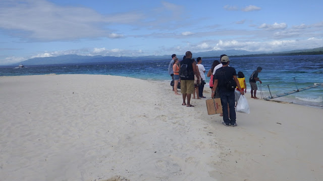 passengers boarding the boat going back to mainland from Canigao Island in Matalom, Leyte